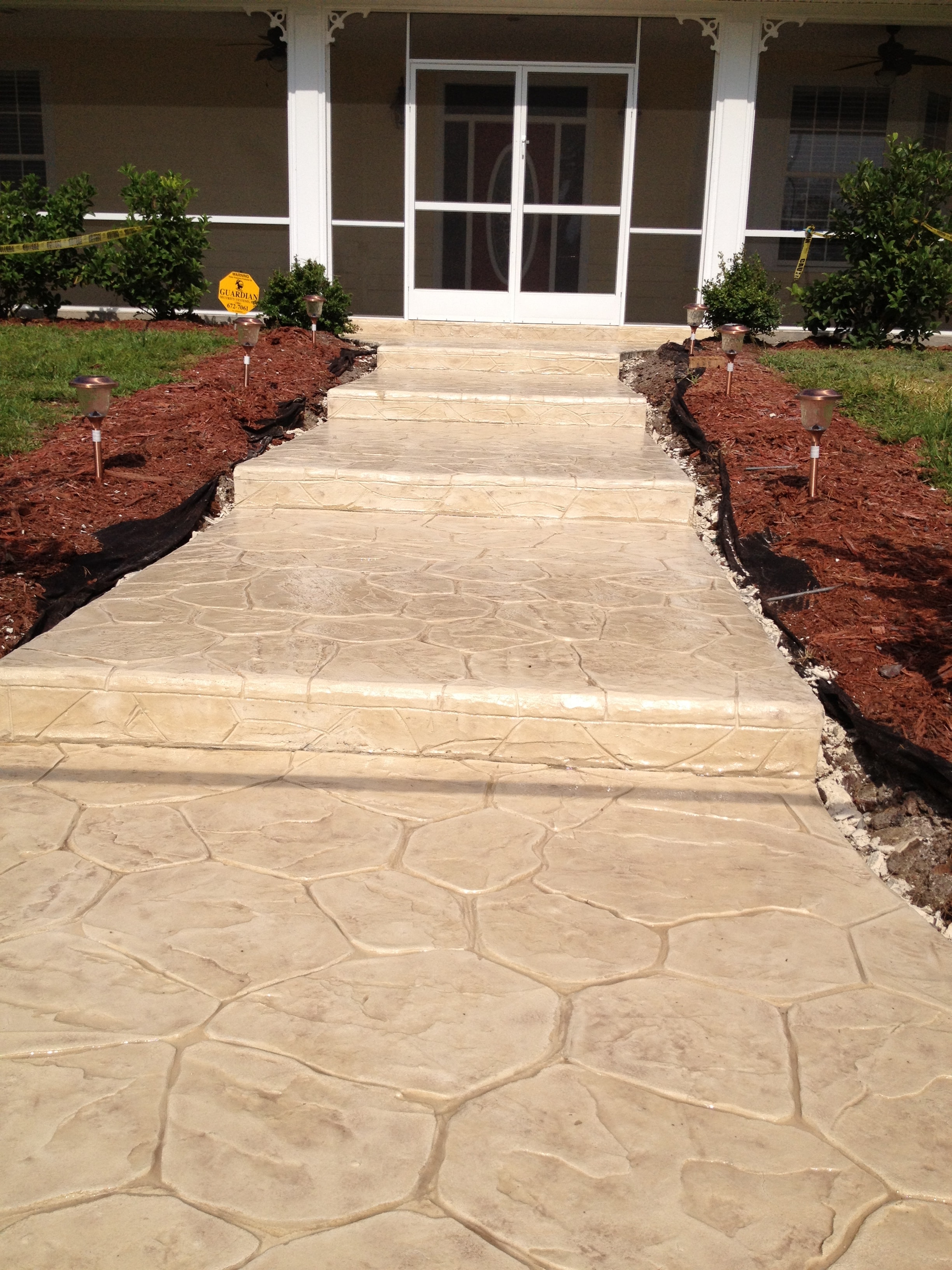 LunaCrete — concrete walkway leading to house entrance