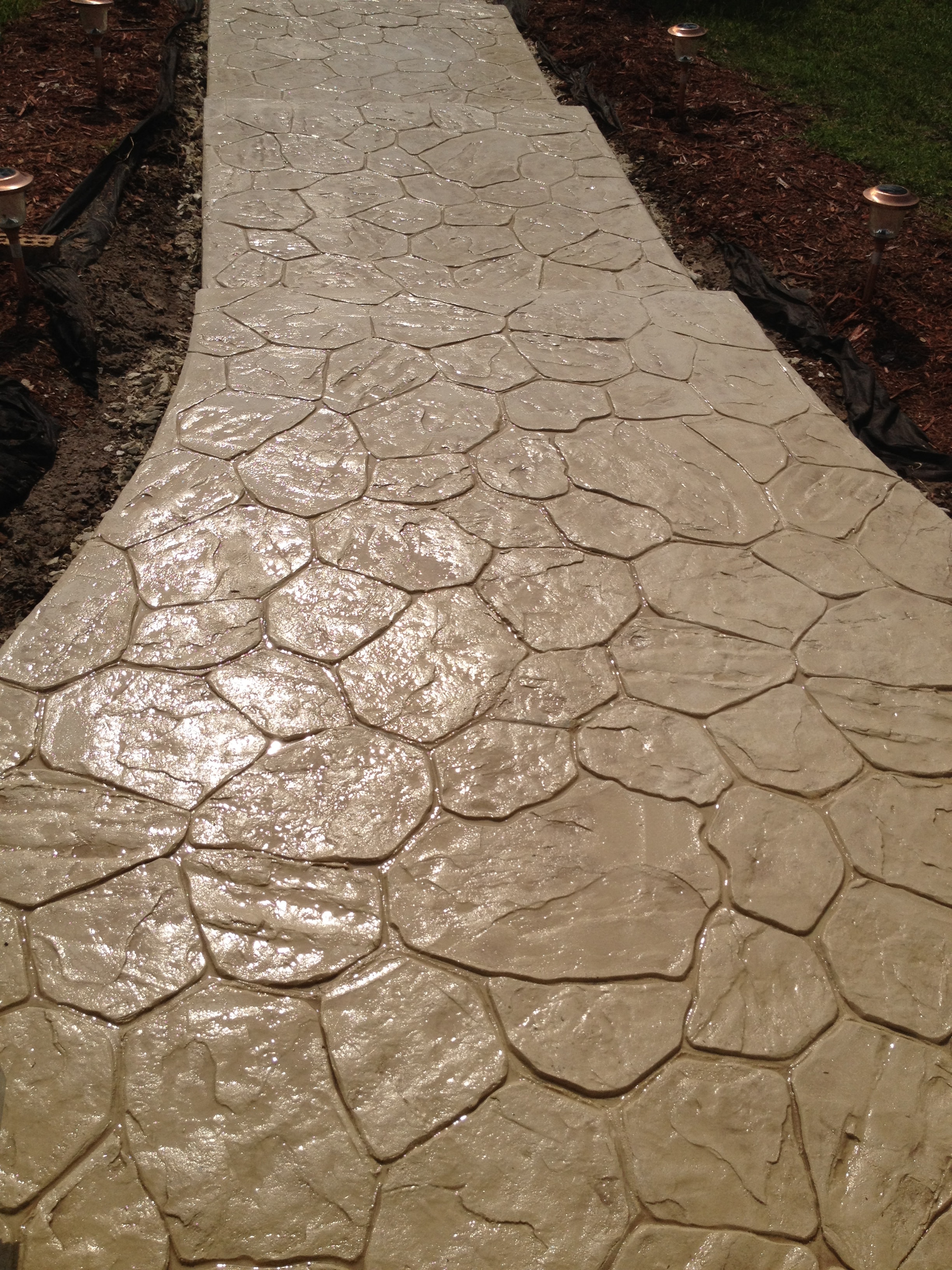 LunaCrete — stamped concrete pathway garden landscape