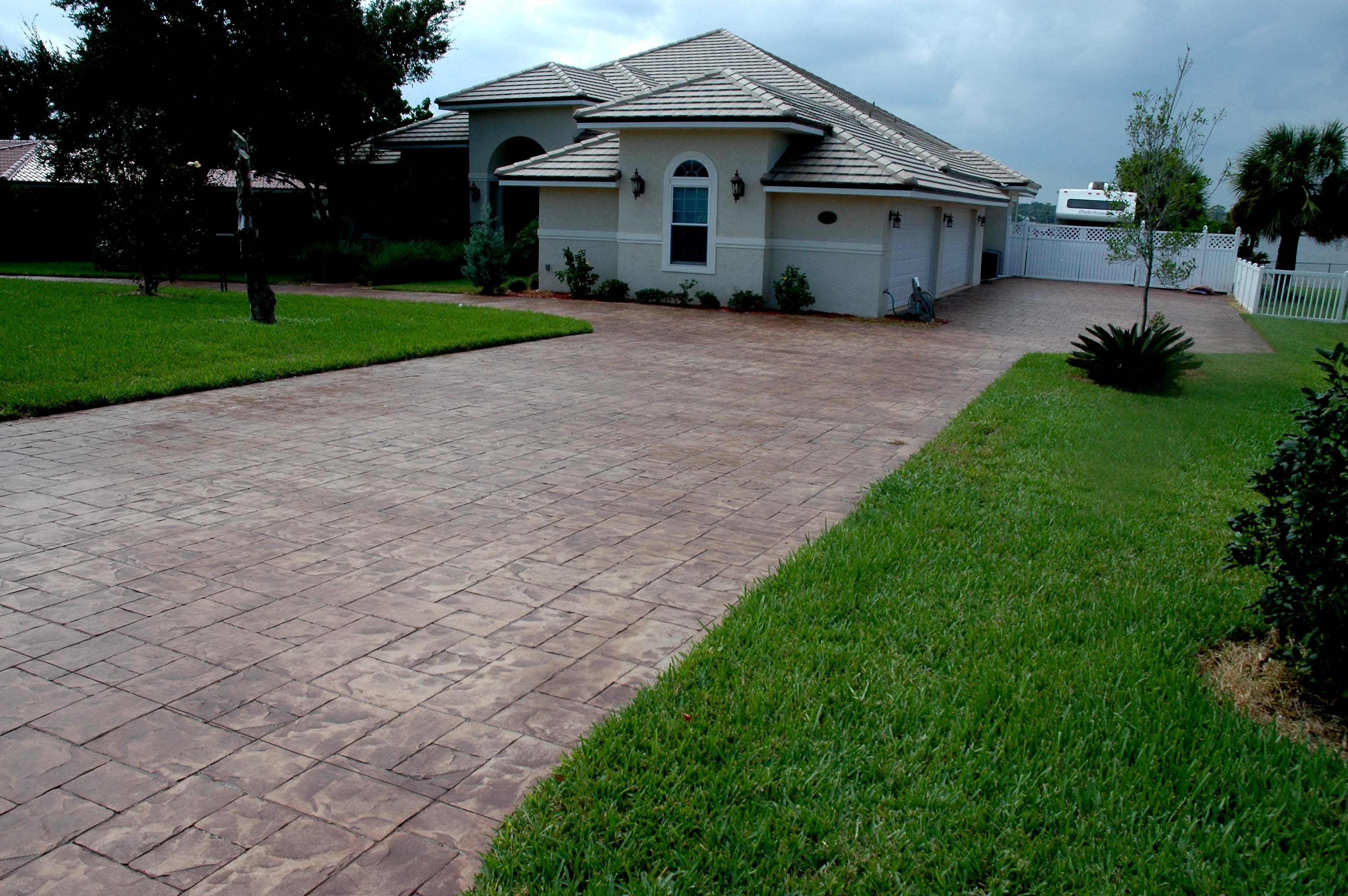 LunaCrete — modern Florida home brick driveway landscaping