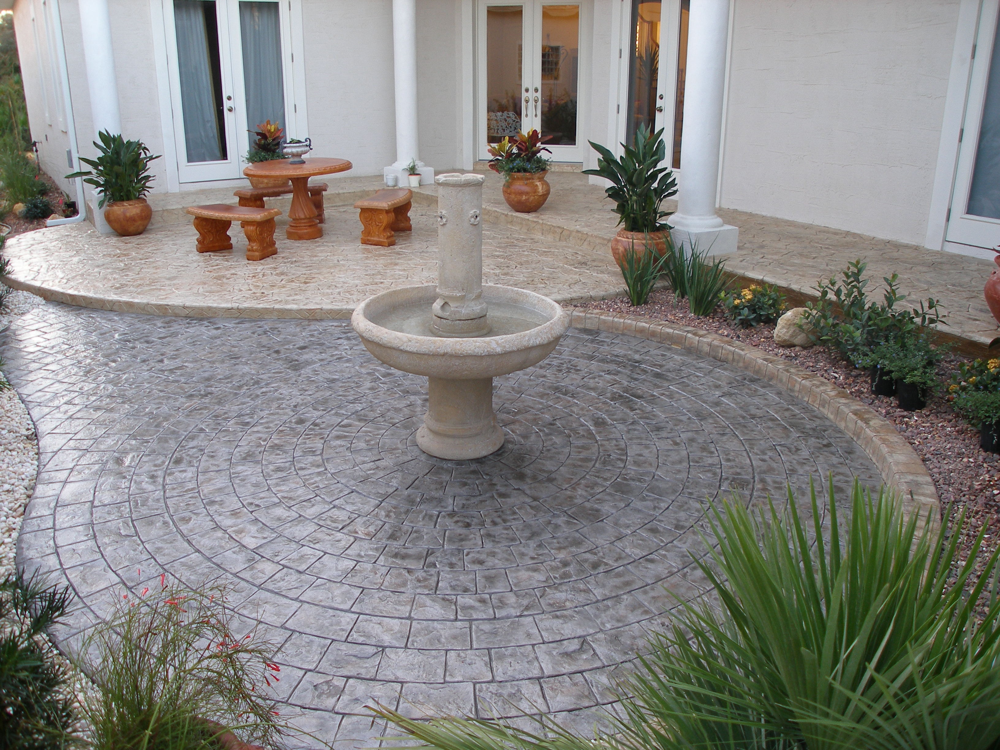LunaCrete — patio courtyard with central fountain and seating